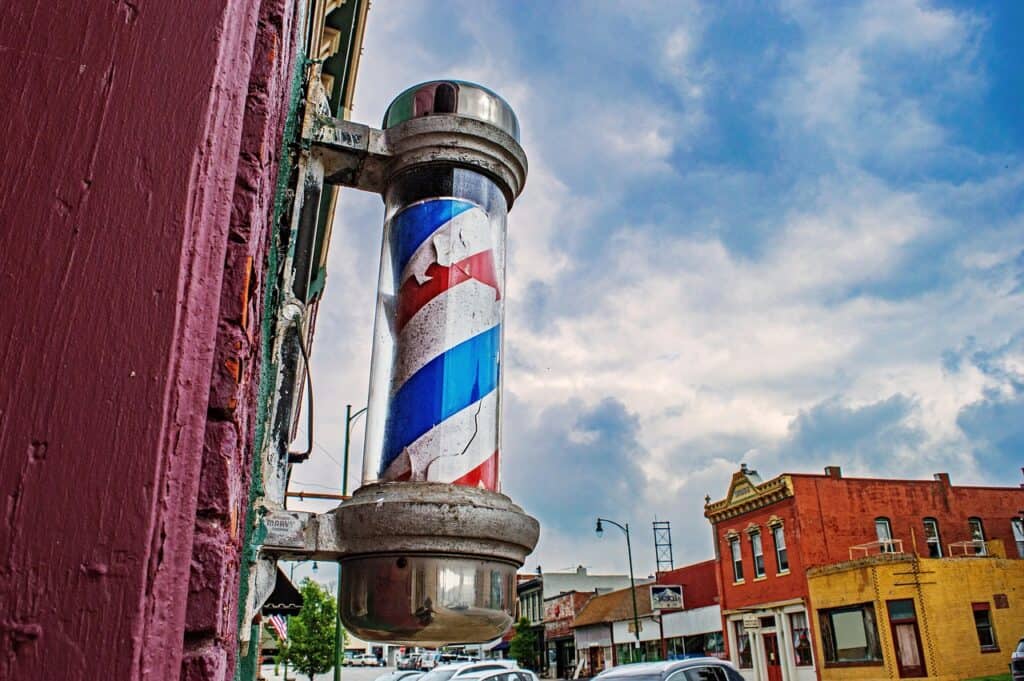 chipping barber pole in small American downtown